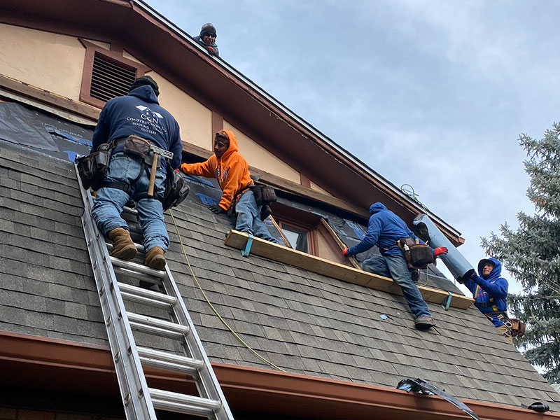 Construction Workers Working On A Composite Roof
